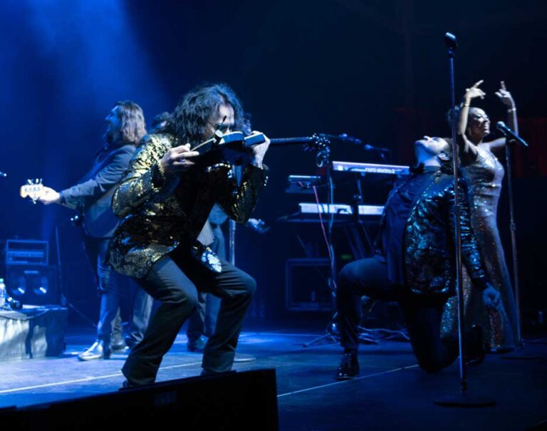 Liquid Blue Lead Guitarist Arnie Playing Guitar with Mouth